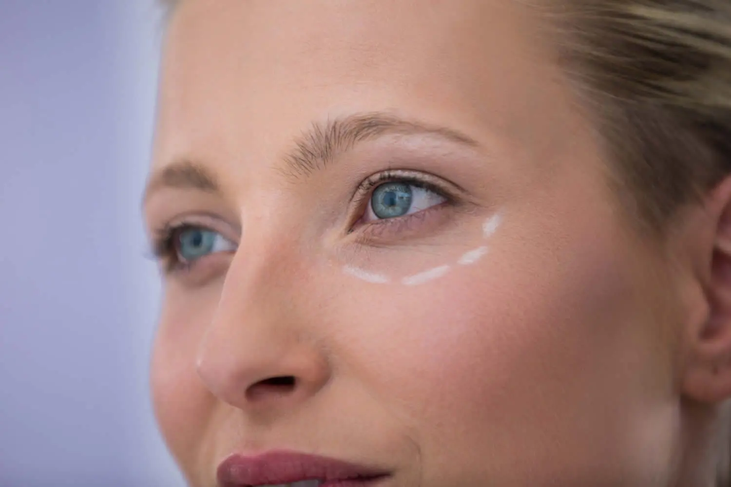 woman-with-marks-drawn-cosmetic-treatment-at-cosmetic-dermatologist
